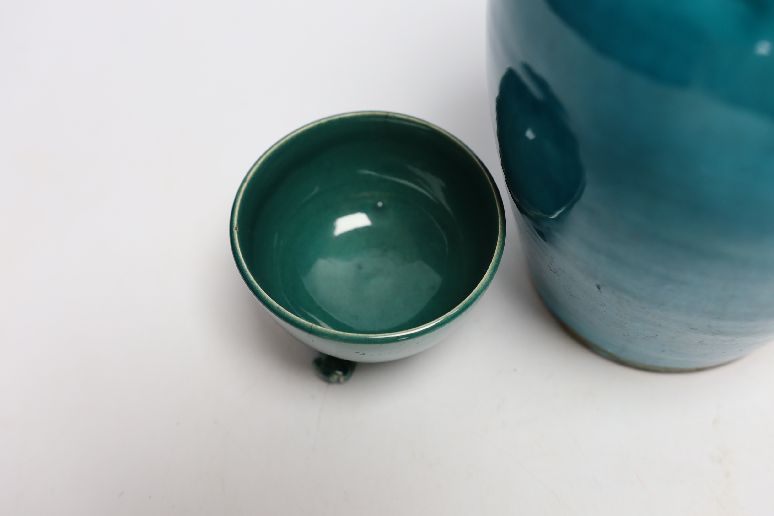 A turquoise glazed three footed bowl and jug and a small Chinese famille rose jug, largest 25cm high
